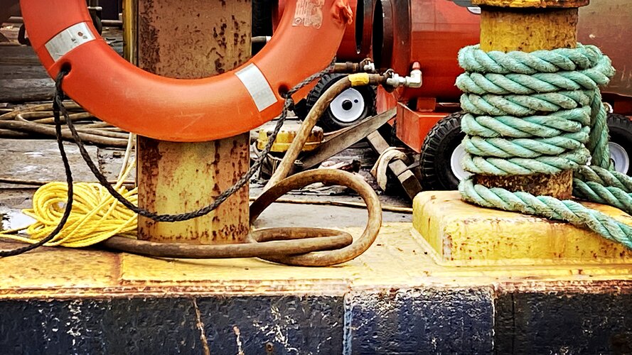 Life Saver - Ring Buoy on the Deck of a Work Barge with Ropes